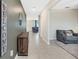 Bright entryway with tile floors, a console table, and views into the living room at 13614 Wild Ginger St, Riverview, FL 33579