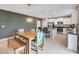 Modern kitchen with stainless steel appliances and a farmhouse dining table at 13614 Wild Ginger St, Riverview, FL 33579