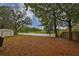 Backyard oasis with lake view and a relaxing patio area at 1415 Mohrlake Dr, Brandon, FL 33511