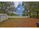 Spacious backyard with lake view and wooden privacy fence at 1415 Mohrlake Dr, Brandon, FL 33511