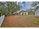 Large backyard with shed, privacy fence, and open grassy area at 1415 Mohrlake Dr, Brandon, FL 33511