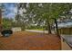 Serene backyard with lake view and privacy fence at 1415 Mohrlake Dr, Brandon, FL 33511