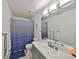 Clean bathroom with single vanity and shower at 1415 Mohrlake Dr, Brandon, FL 33511