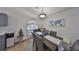 Dining area with wood table, gray chairs, and a world map on the wall at 1415 Mohrlake Dr, Brandon, FL 33511