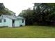 Large backyard with a grassy area and a shed at 1601 Essex N Dr, St Petersburg, FL 33710