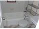 Clean bathroom with a bathtub, toilet, and sink at 1601 Essex N Dr, St Petersburg, FL 33710