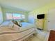 Bright bedroom with a comfortable bed and large window at 1701 Pinehurst Rd # 8B, Dunedin, FL 34698