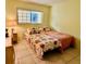 Guest bedroom with two twin-size beds at 1701 Pinehurst Rd # 8B, Dunedin, FL 34698