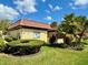 Community building with nicely landscaped grounds at 1701 Pinehurst Rd # 8B, Dunedin, FL 34698