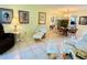 Bright living room with comfy seating and a dining area at 1701 Pinehurst Rd # 8B, Dunedin, FL 34698