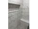 Modern shower with marble-look tiles and pebble floor at 1751 Yale S St, St Petersburg, FL 33711