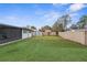 Landscaped backyard with artificial turf and storage shed at 1807 W Crawford St, Tampa, FL 33604