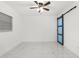 Bedroom featuring barn door and ceiling fan at 1807 W Crawford St, Tampa, FL 33604