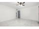 Spacious bedroom with ceiling fan and access to bathroom at 1807 W Crawford St, Tampa, FL 33604