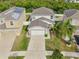 Two-story house with a two-car garage and landscaped yard at 1966 Hawks View Dr, Ruskin, FL 33570