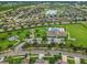 Aerial view showing community pool, playground and surrounding homes at 1966 Hawks View Dr, Ruskin, FL 33570