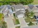 Two-story house with a two-car garage and landscaped yard at 1966 Hawks View Dr, Ruskin, FL 33570