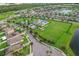 Aerial view of community amenities including pool, playground, and park at 1966 Hawks View Dr, Ruskin, FL 33570