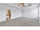 Large bedroom with carpet, ceiling fan and ensuite bathroom at 1966 Hawks View Dr, Ruskin, FL 33570