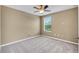 Simple bedroom with carpeted floor, ceiling fan, and window coverings at 1966 Hawks View Dr, Ruskin, FL 33570