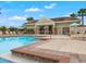 Community pool with lounge chairs and cabana at 1966 Hawks View Dr, Ruskin, FL 33570