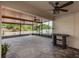 Spacious covered patio with ceiling fans and a bar at 1966 Hawks View Dr, Ruskin, FL 33570