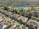 Beautiful aerial view showcasing the community, including a serene lake and lush green spaces at 2124 Sifield Greens Way # 11, Sun City Center, FL 33573