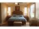 Bright main bedroom featuring a tray ceiling, ceiling fan, and lots of natural light at 2124 Sifield Greens Way # 11, Sun City Center, FL 33573