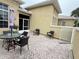 Outdoor patio area with seating for relaxing and entertaining at 2124 Sifield Greens Way # 11, Sun City Center, FL 33573