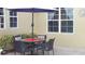 Outdoor patio featuring a dining set, ideal for enjoying meals in the open air at 2124 Sifield Greens Way # 11, Sun City Center, FL 33573