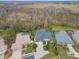 An aerial view of the property highlighting the roof, yard, and the surrounding neighborhood at 2126 Larchwood Ct, Trinity, FL 34655