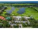 Aerial view of community with clubhouse, pool, and golf course at 2126 Larchwood Ct, Trinity, FL 34655