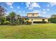 House with a screened pool and lush backyard at 2126 Larchwood Ct, Trinity, FL 34655