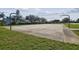 Community basketball court with two hoops and ample space at 2126 Larchwood Ct, Trinity, FL 34655