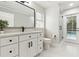 Modern bathroom with white cabinets, hexagon tile, and walk-in shower at 2126 Larchwood Ct, Trinity, FL 34655