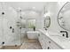 Elegant bathroom with double vanity, soaking tub, and walk-in shower at 2126 Larchwood Ct, Trinity, FL 34655