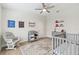 Bedroom with crib, changing table, and plenty of storage at 2126 Larchwood Ct, Trinity, FL 34655