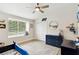 bedroom with navy dresser and playful decor at 2126 Larchwood Ct, Trinity, FL 34655