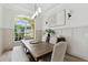 Elegant dining room featuring a large wood table and neutral color palette at 2126 Larchwood Ct, Trinity, FL 34655