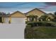 Charming home with a 3-car garage, mature landscaping, and a well-manicured lawn at 2126 Larchwood Ct, Trinity, FL 34655