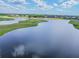 Peaceful golf course with a serene lake and homes nearby at 2126 Larchwood Ct, Trinity, FL 34655