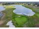 Golf course with water features and a sand trap at 2126 Larchwood Ct, Trinity, FL 34655