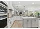 Spacious kitchen with stainless steel appliances and white cabinetry at 2126 Larchwood Ct, Trinity, FL 34655