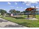 Community playground with play area and picnic table at 2126 Larchwood Ct, Trinity, FL 34655