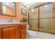 Clean bathroom with a tub shower, wood vanity, and mirror at 2241 Heron Circle, Clearwater, FL 33762