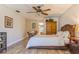 Bedroom with wood sleigh bed, ceiling fan, and wood armoire at 2241 Heron Circle, Clearwater, FL 33762