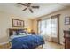 Bright bedroom with a double bed, wood floors, and large windows at 2241 Heron Circle, Clearwater, FL 33762