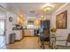 Bright kitchen with light wood cabinets, a breakfast nook, and modern appliances at 2241 Heron Circle, Clearwater, FL 33762