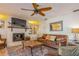 Living room with hardwood floors, fireplace and built-in shelving at 2241 Heron Circle, Clearwater, FL 33762