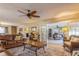 Spacious living room featuring hardwood floors, a fireplace, and ample natural light at 2241 Heron Circle, Clearwater, FL 33762